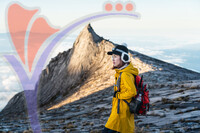 Young Woman Trekker With Backpack Standing in Mount Kinabalu