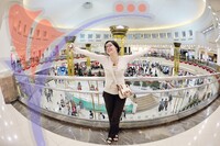 Happy Young Women Shopping in Big Modern City Mall
