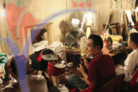 Chinese Opera Performers Applying Make - Up